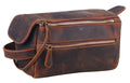 Brown leather toiletry bag with zippers on a white background