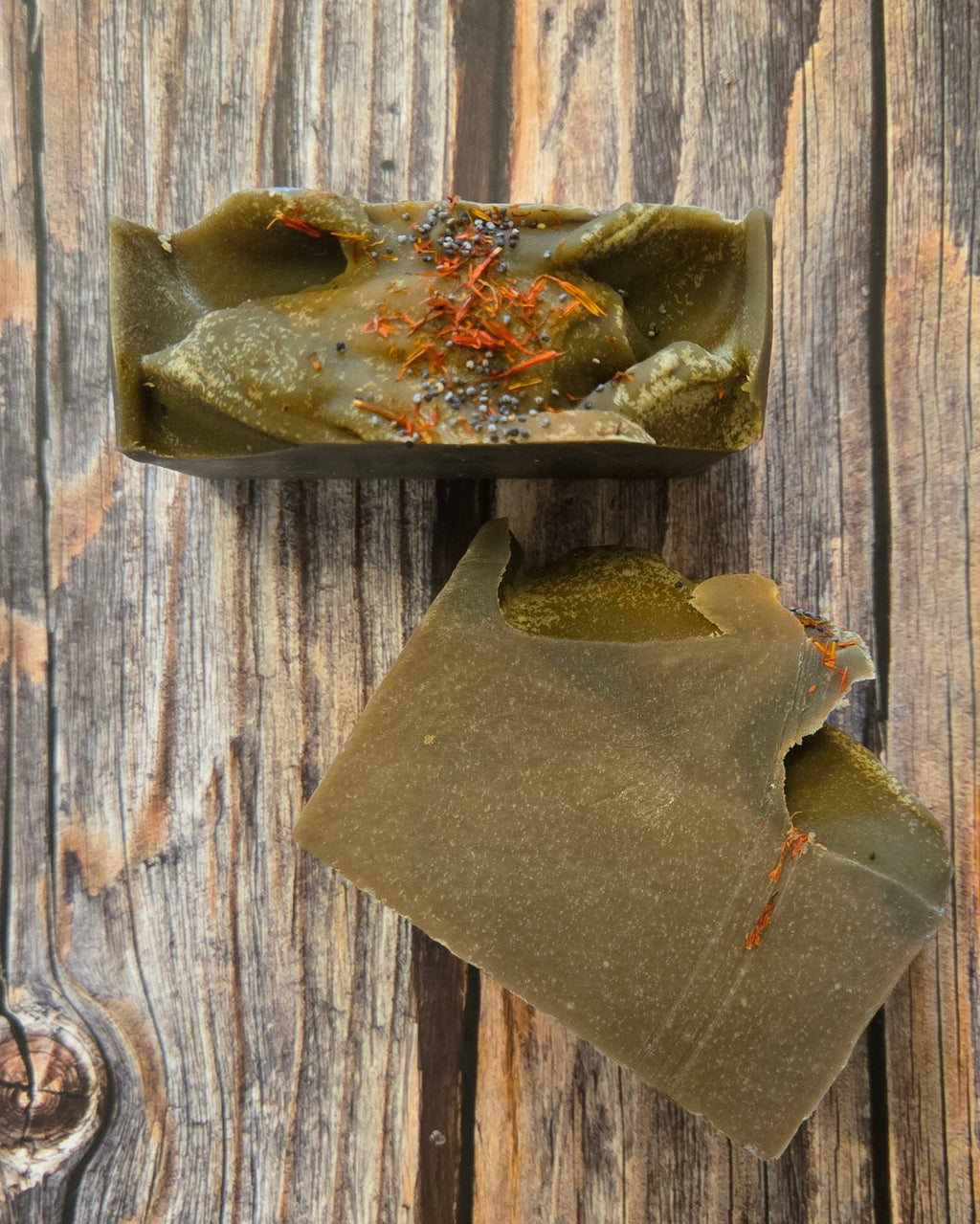 Green leafy vegetable with orange specks on a wooden surface
