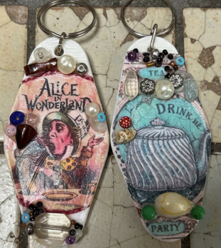 A pair of hand decorated retro motel keyrings.
