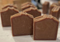 Chocolate bars on a light surface with a blurred background