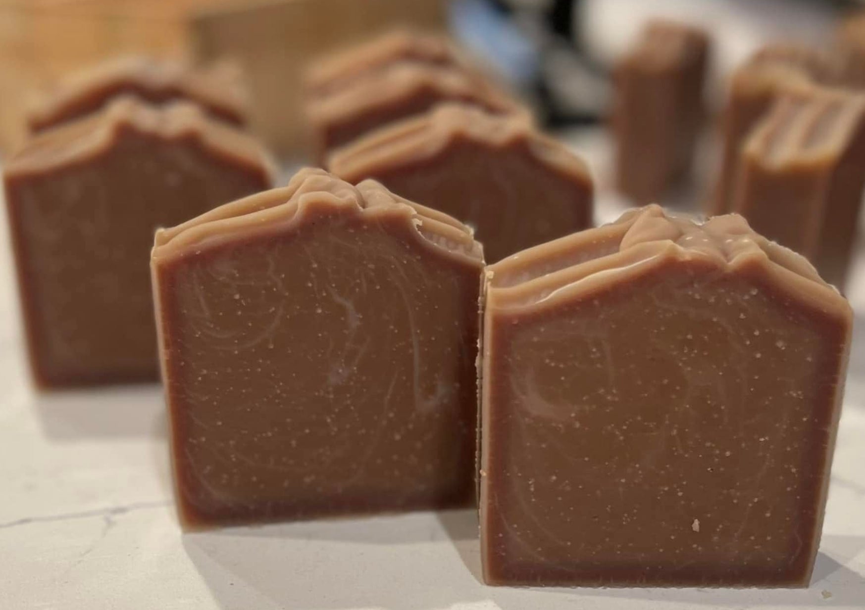 Chocolate bars on a light surface with a blurred background
