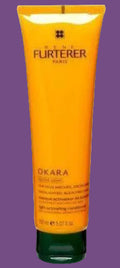 Orange hair care product tube with 'René Furterer' branding on a white background