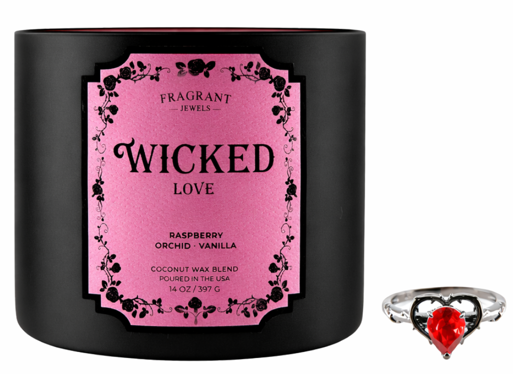 Black candle with pink label 'Wicked Love' and a red heart ring on a white background