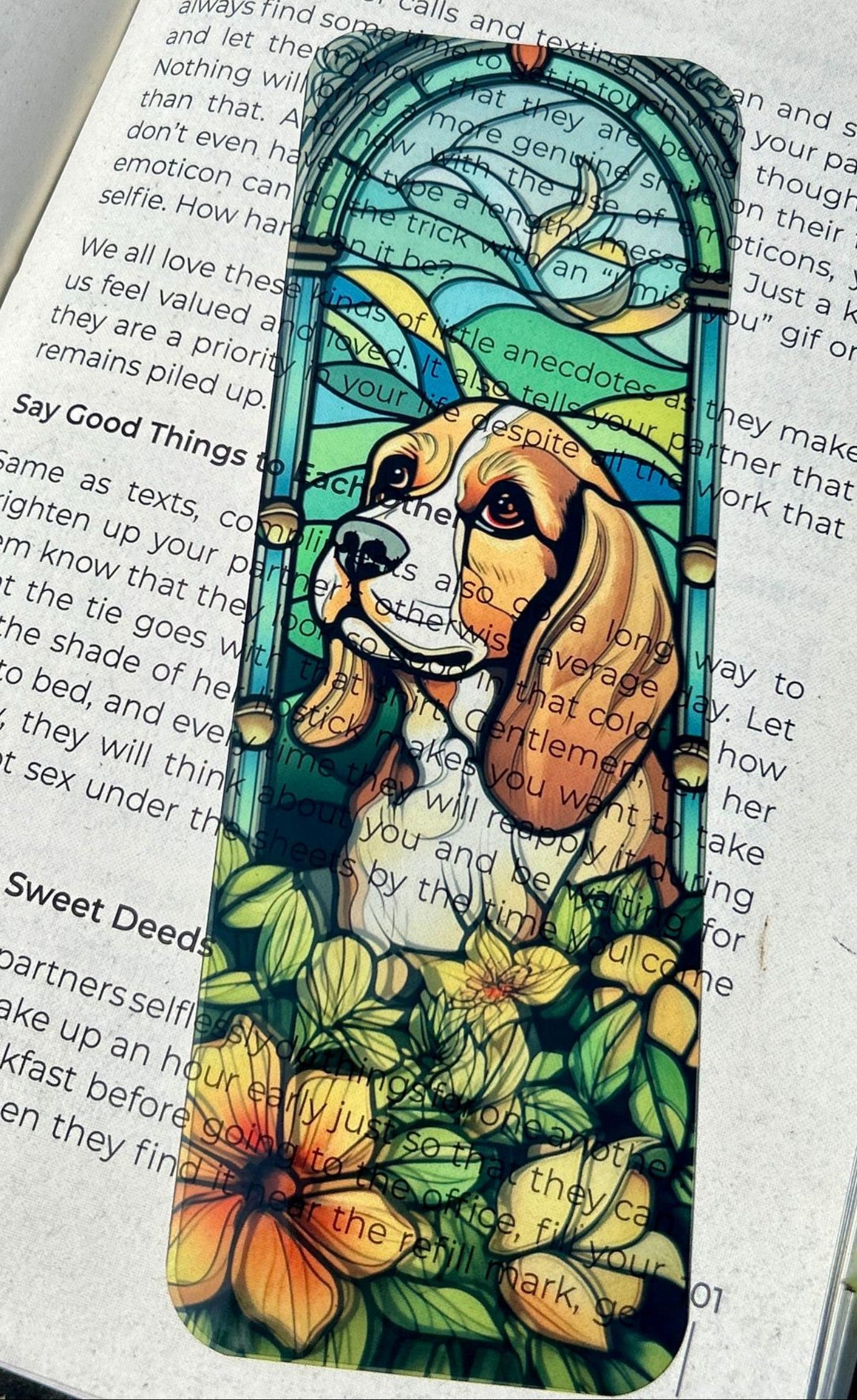 Stained glass-style bookmark with a dog design on an open book