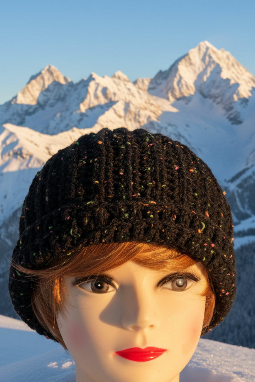 Mannequin head wearing a black textured hat with a blurred background