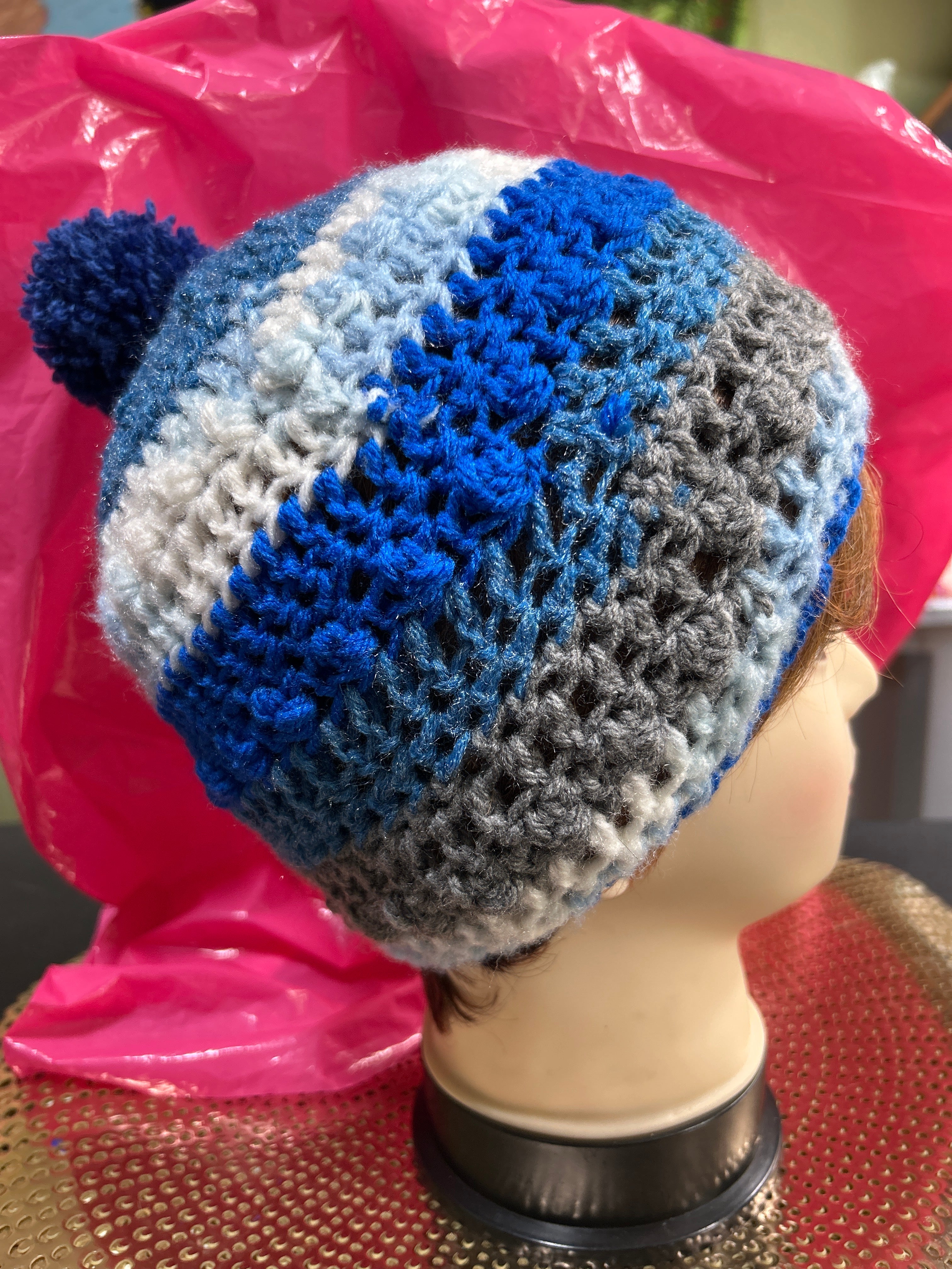 Handmade crocheted beanie in shades of blue, grey & white.