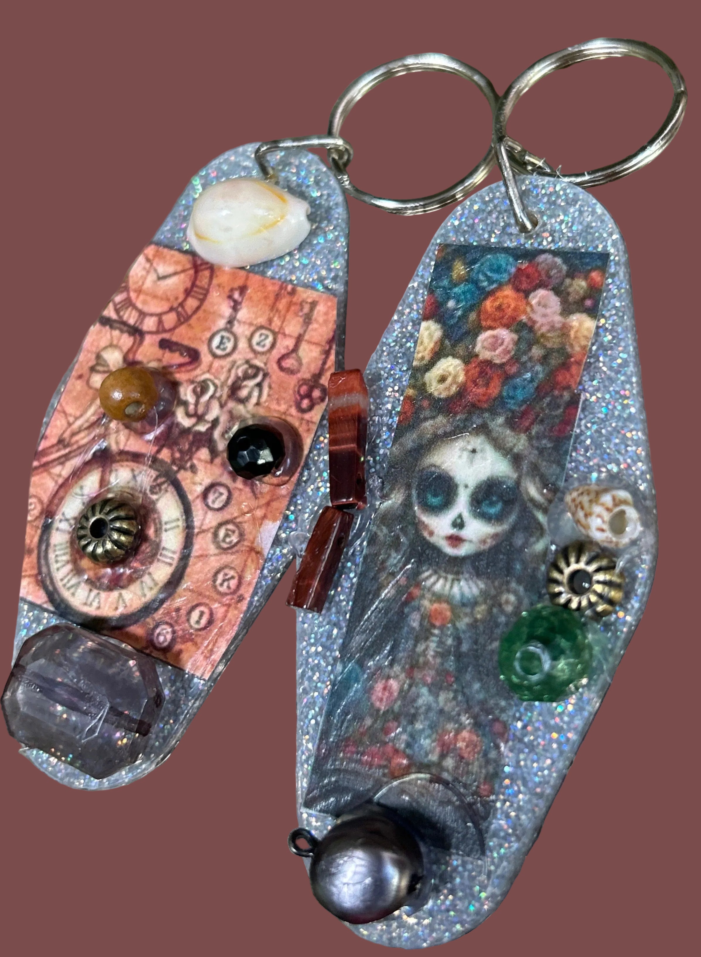 Decorative pocket knife with artistic handle design on a textured surface