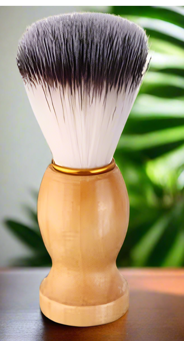 Shaving brush with wooden handle on a reflective surface