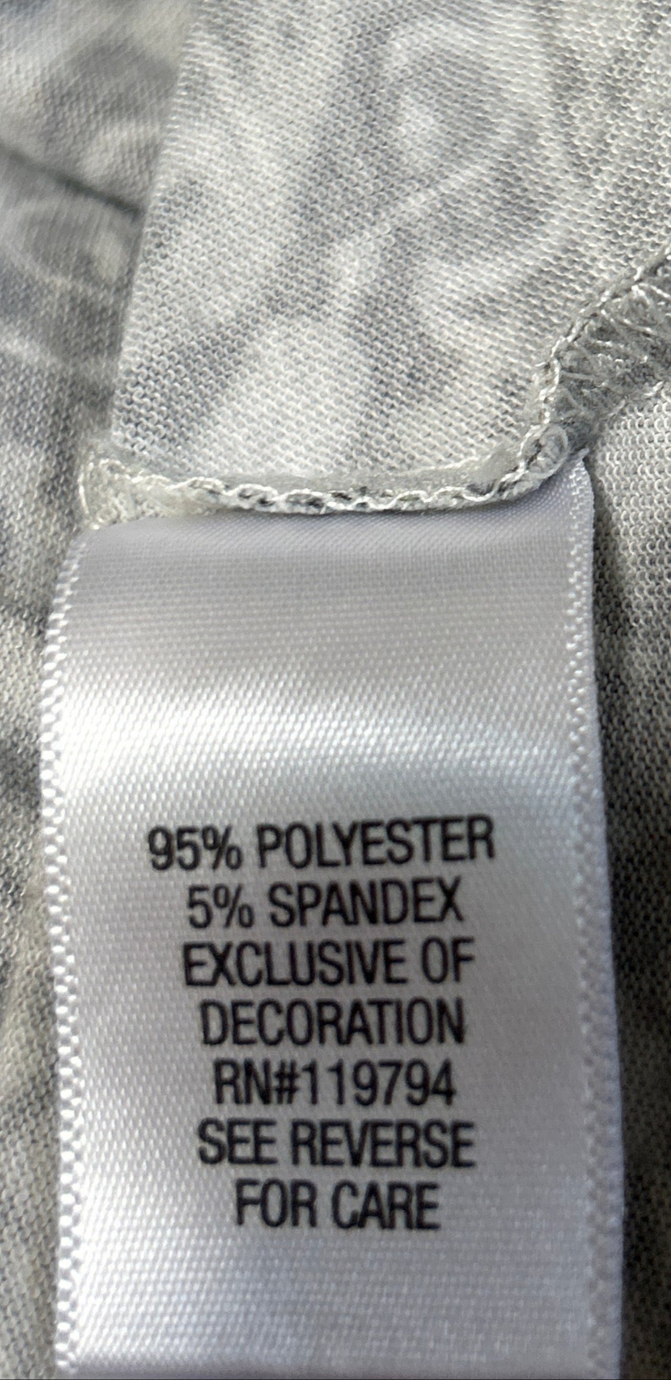 Close-up of a fabric label on a patterned garment
