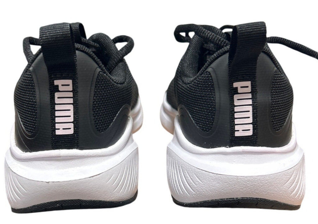 Black and white Puma sneakers on a white background