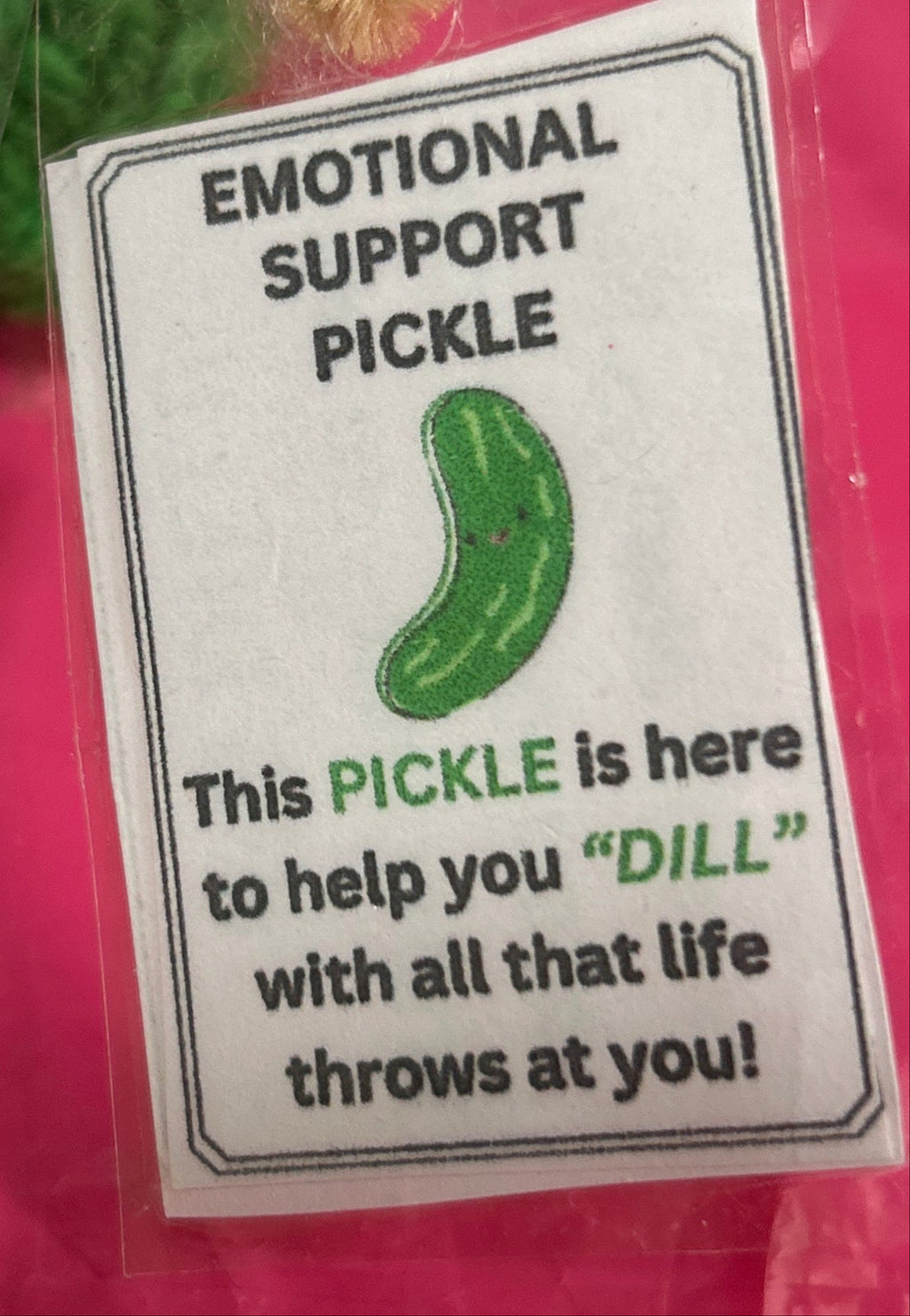 Emotional support pickle with humorous text on a pink background