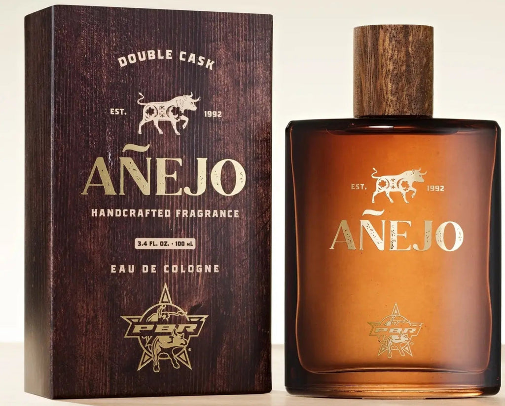 Anejo cologne bottle and packaging on a light background
