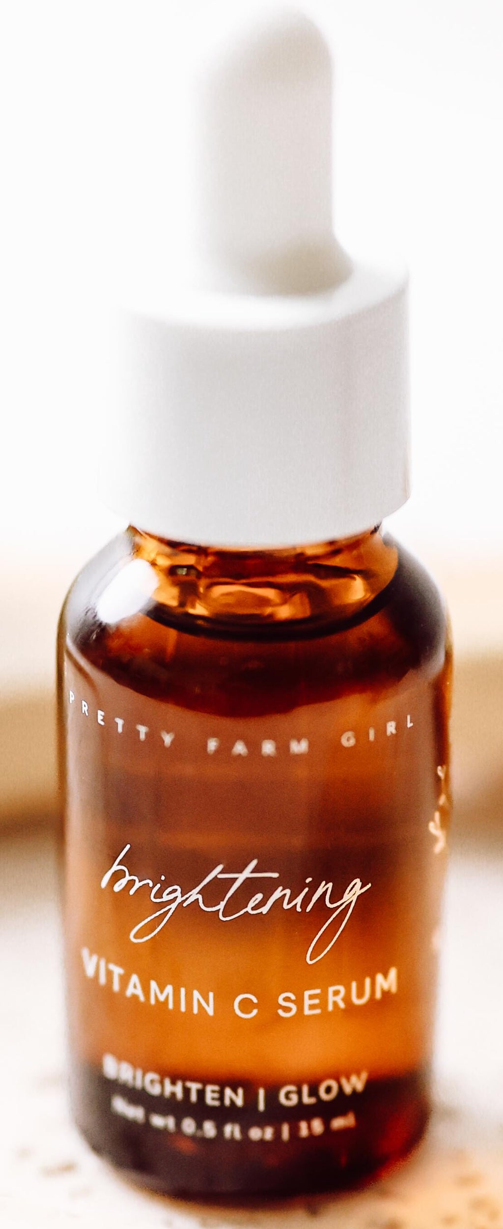 Brown serum bottle with dropper on a light surface