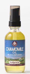 Bottle of chamomile oil with a blue label on a white background
