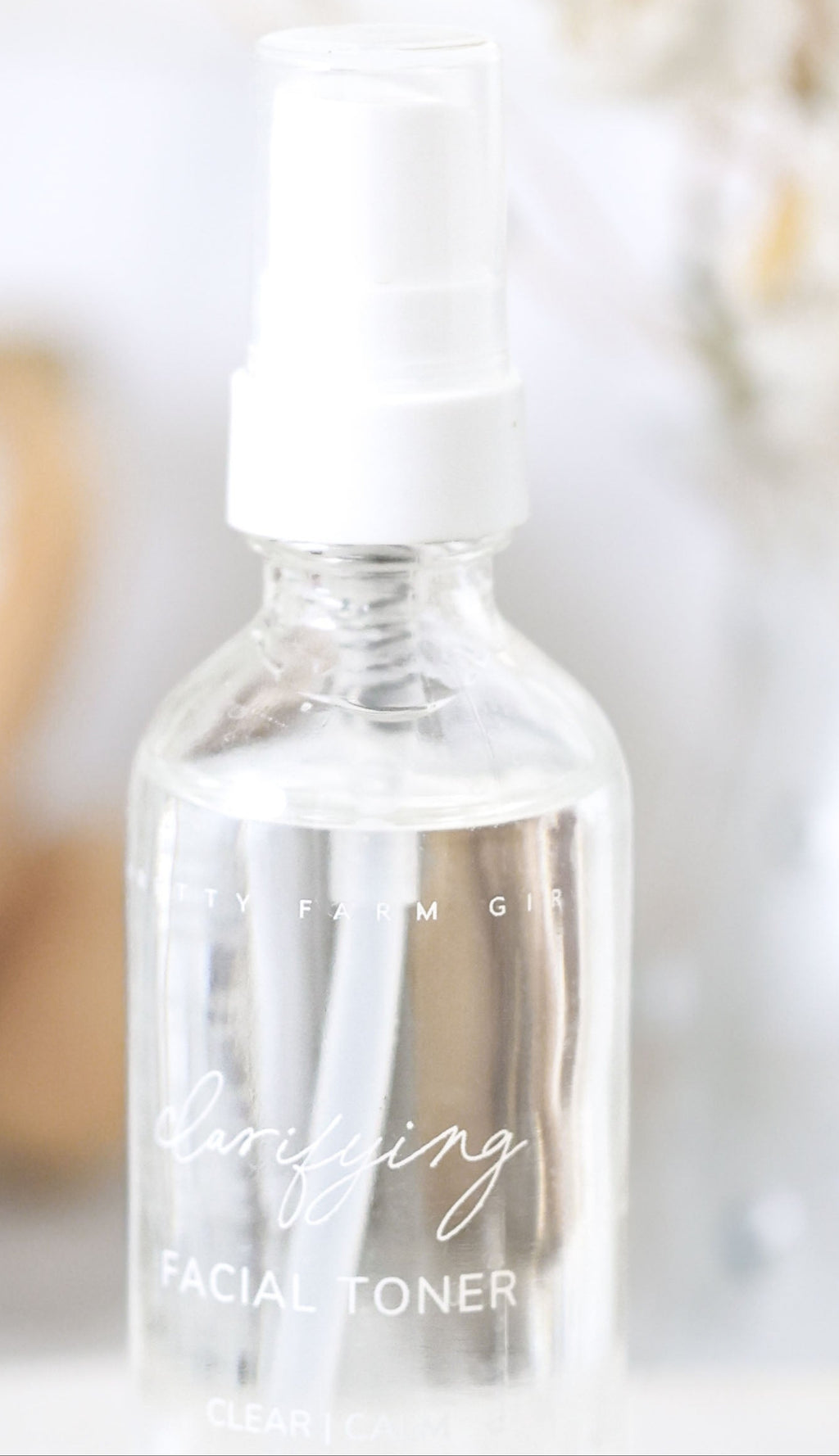 Clear bottle with dropper labeled 'Toning' on a neutral background