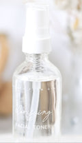 Clear bottle with dropper labeled 'Toning' on a neutral background