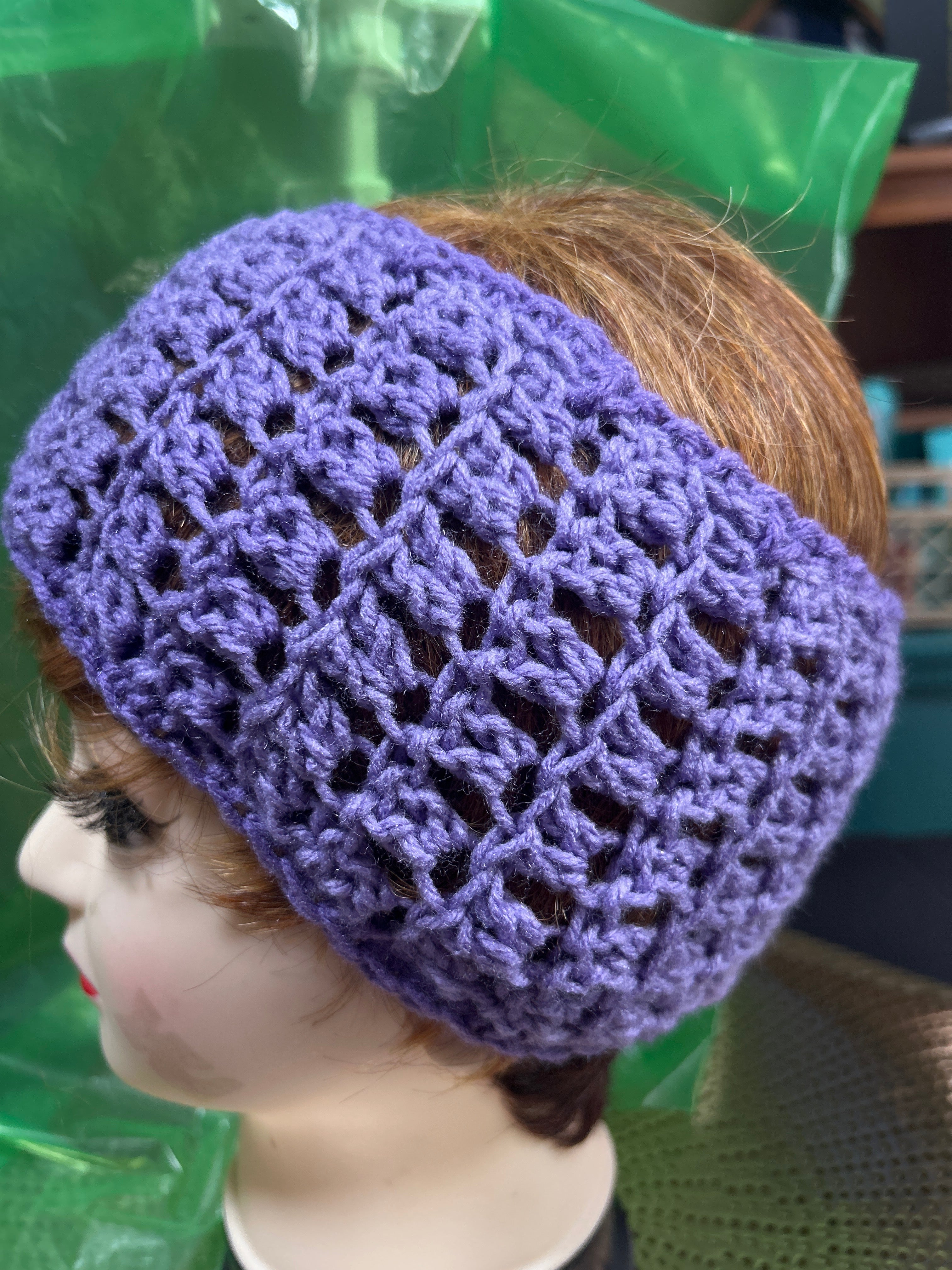 Purple handmade crocheted headband.