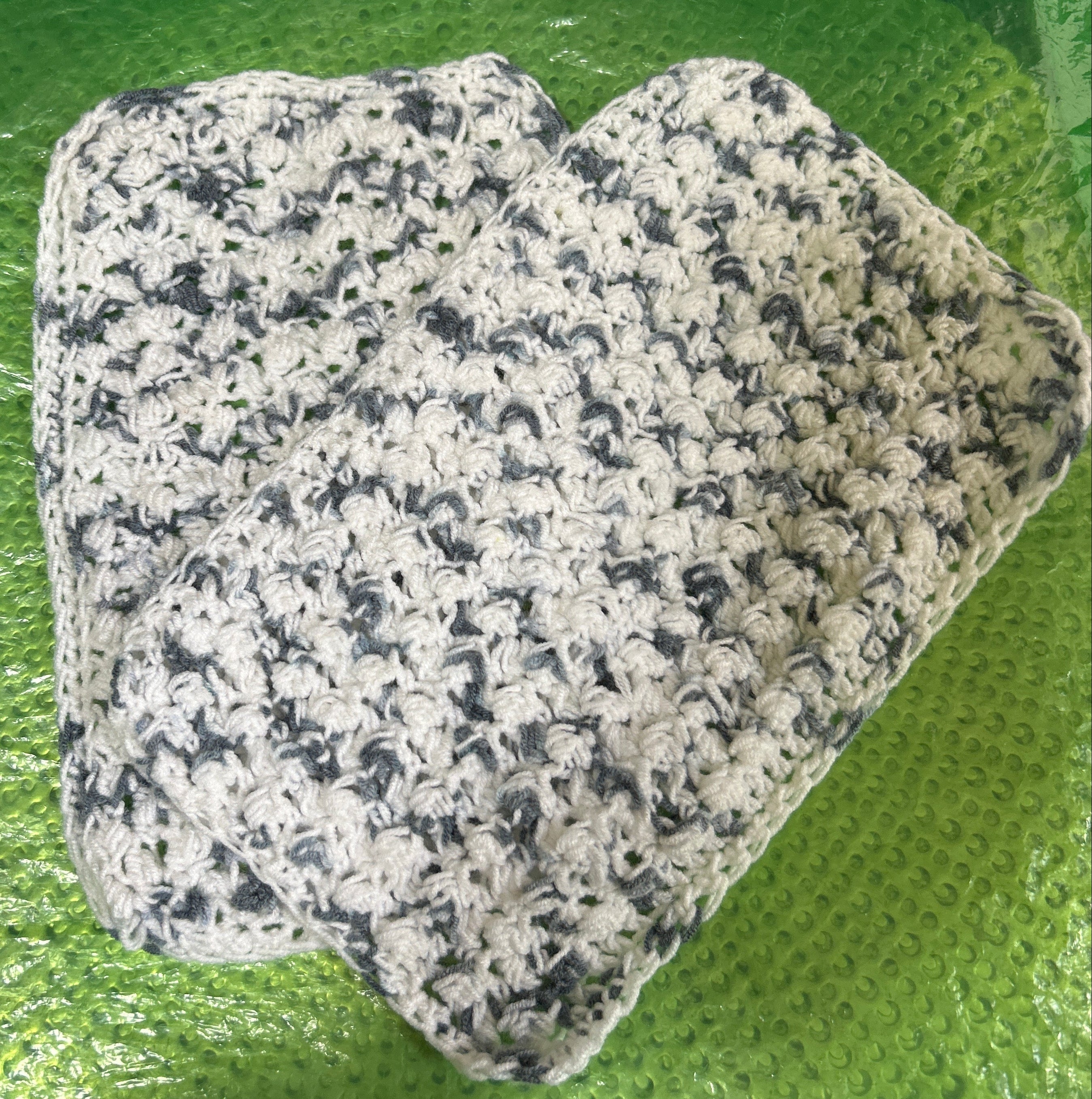 Floral-patterned fabric on a green textured surface