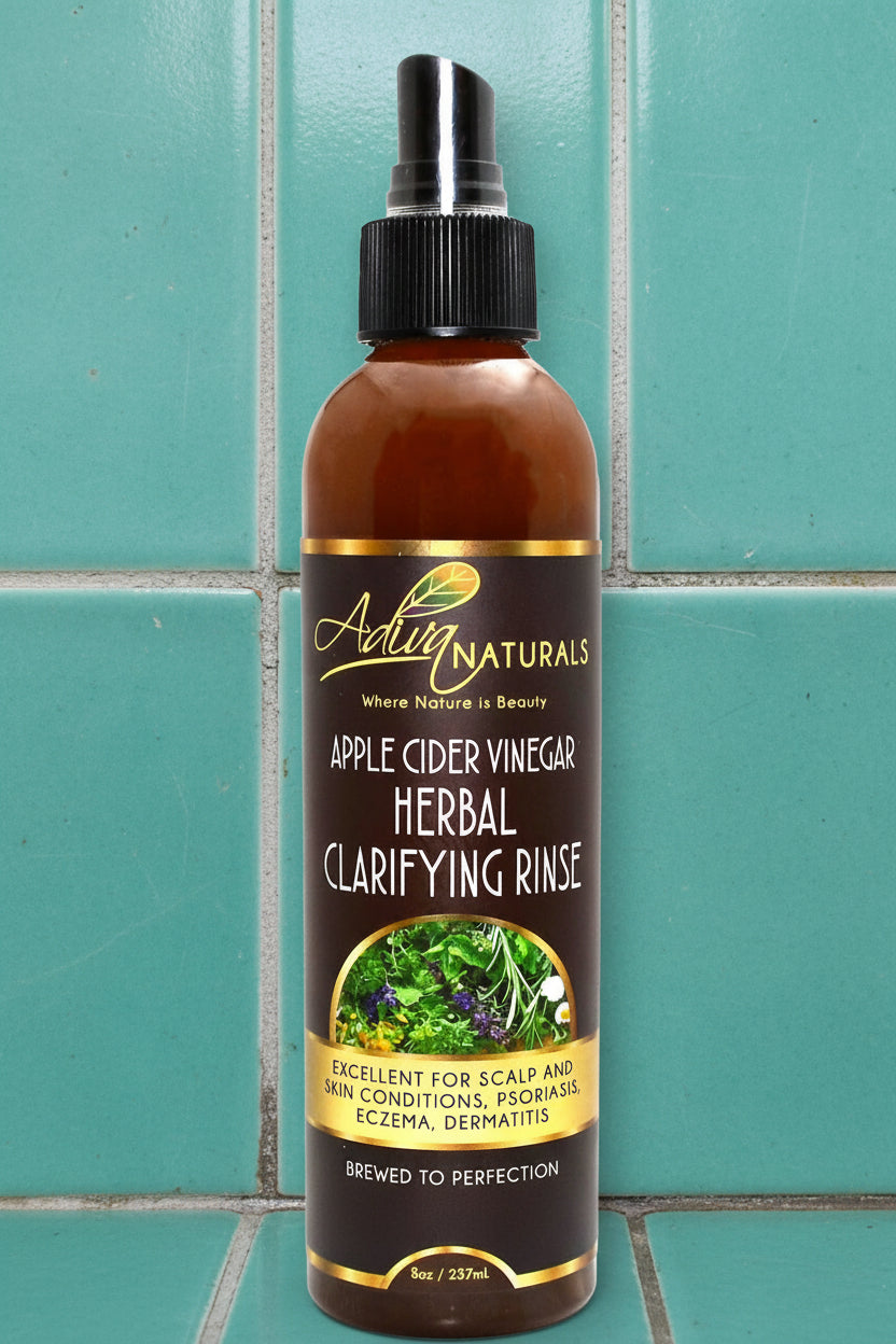 Bottle of Apple Cider Vinegar Herbal Clarifying Rinse with label on a white background