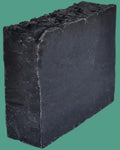 Black soap bar on a white background