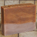 Brown bar of soap on a white background