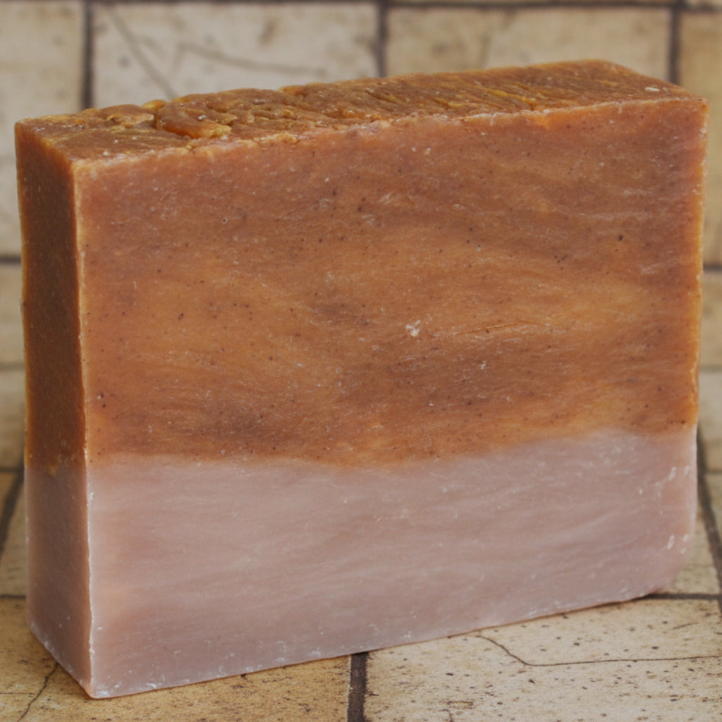 Brown bar of soap on a white background