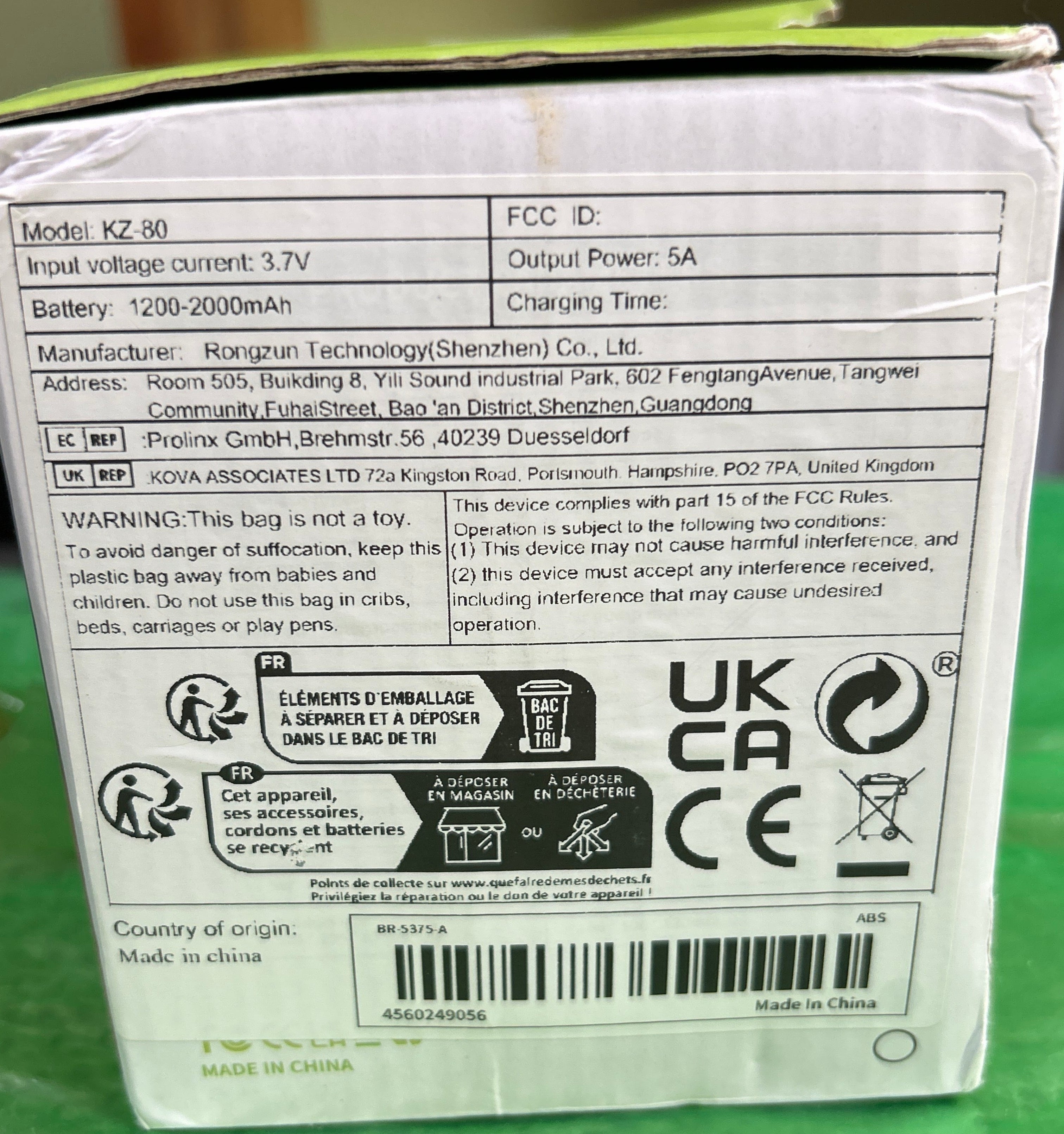 Back of a electronic device packaging with text and logos