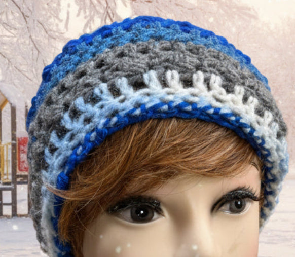 Knitted multicolored beanie on a mannequin head with a snowy playground background