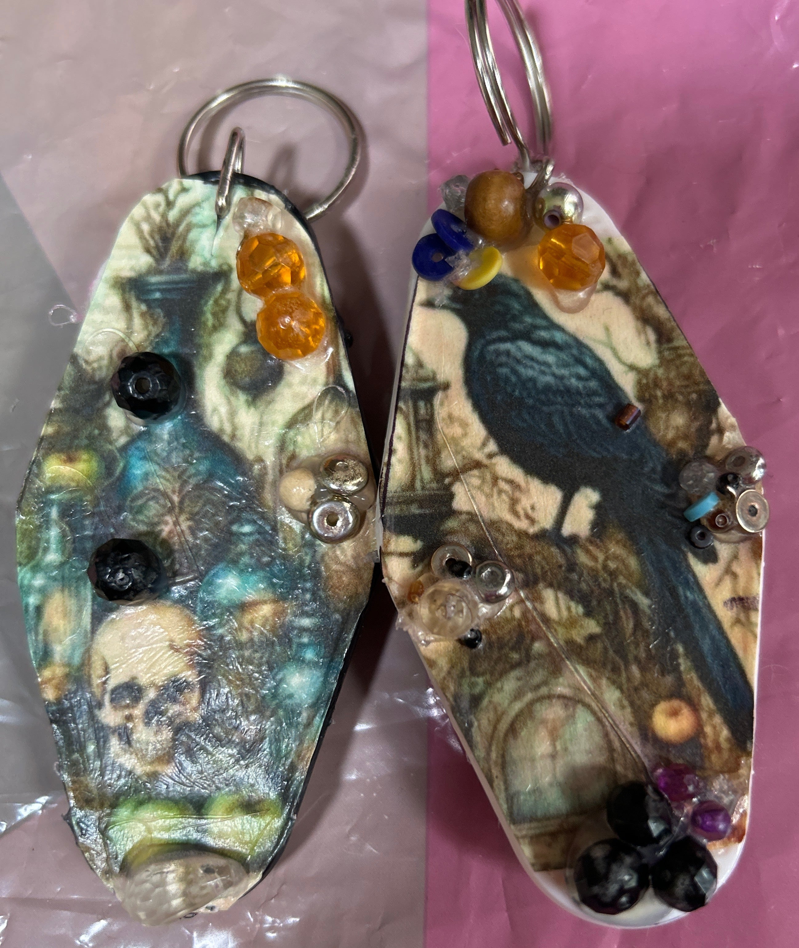 Two fishing lures with camouflage patterns on a pink surface