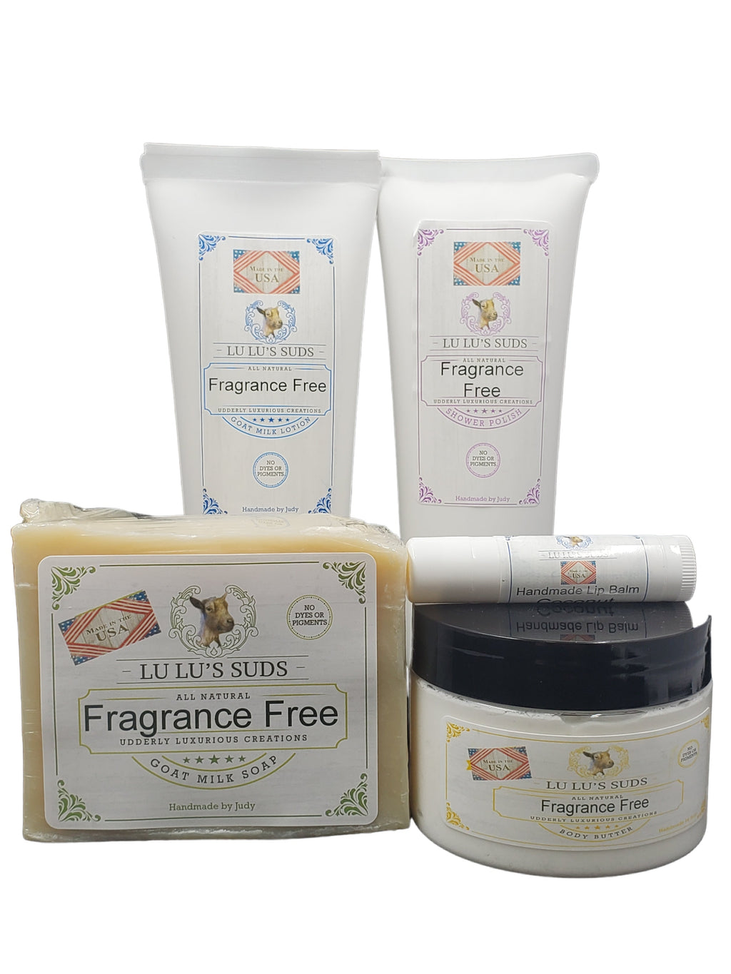Collection of LuLu Suds fragrance-free products including a jar, bar, and two tubes on a white background.