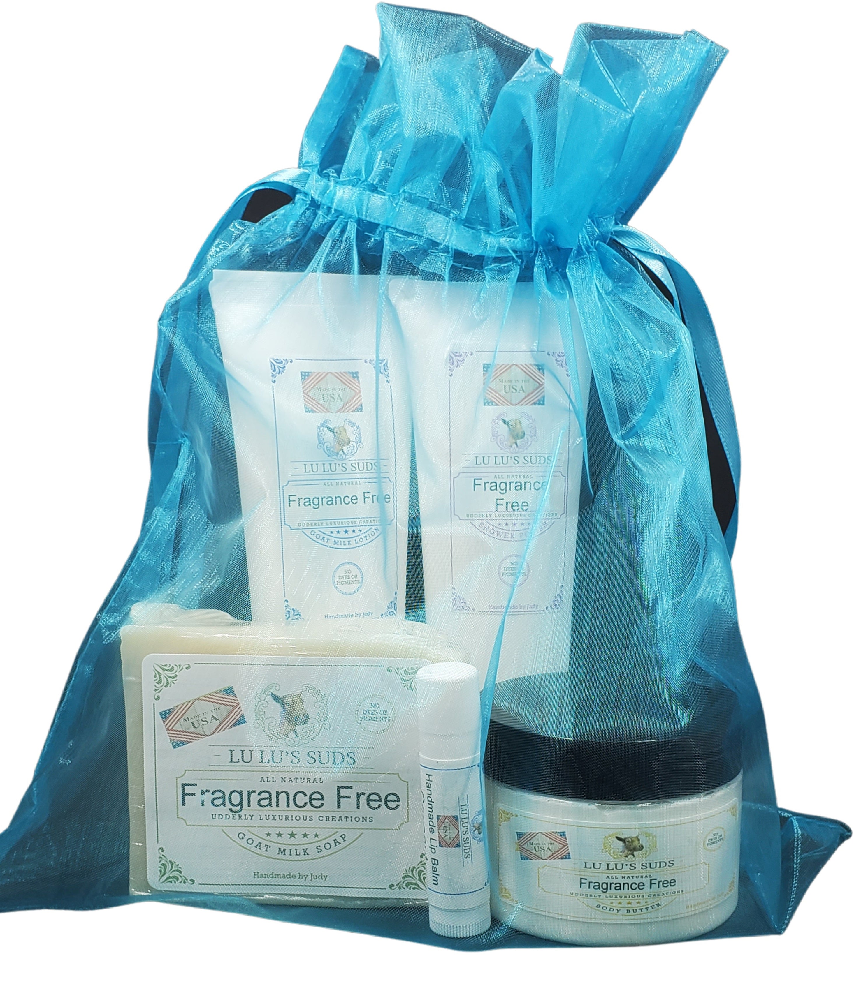 Set of fragrance-free skincare products in a blue drawstring bag on a white background