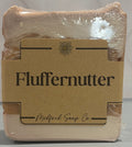 Bar of soap with 'Fluffernutter' packaging on a neutral background