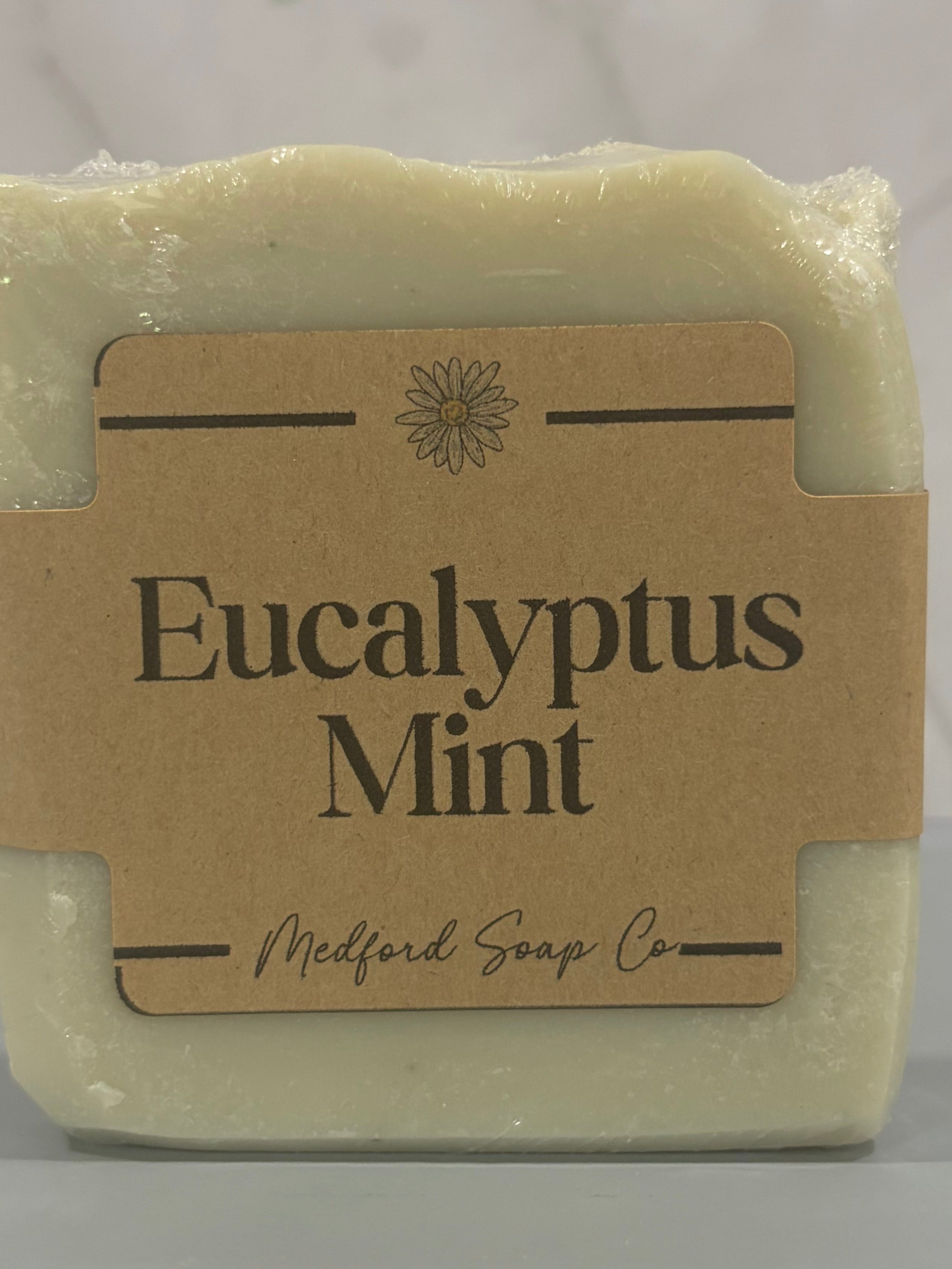 Bar of soap with 'Eucalyptus Mint' label on a marble background