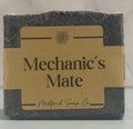 Bar of soap with 'Mechanic's Mate' label on a marble background