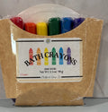 Packaged bath crayons with a cardboard holder on a neutral background
