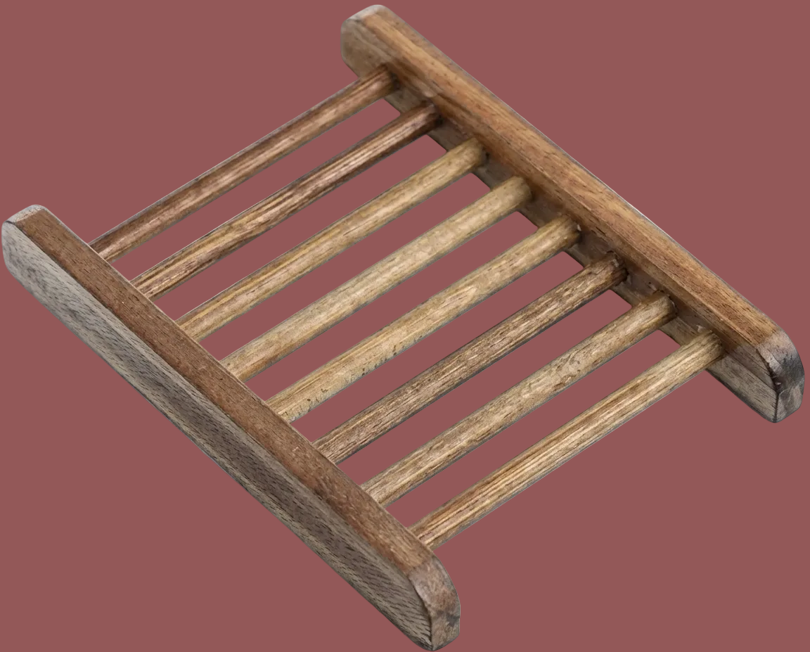 Wooden soap dish with a natural finish on a white background