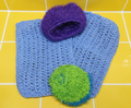 Blue and green scrubber set on a metallic surface