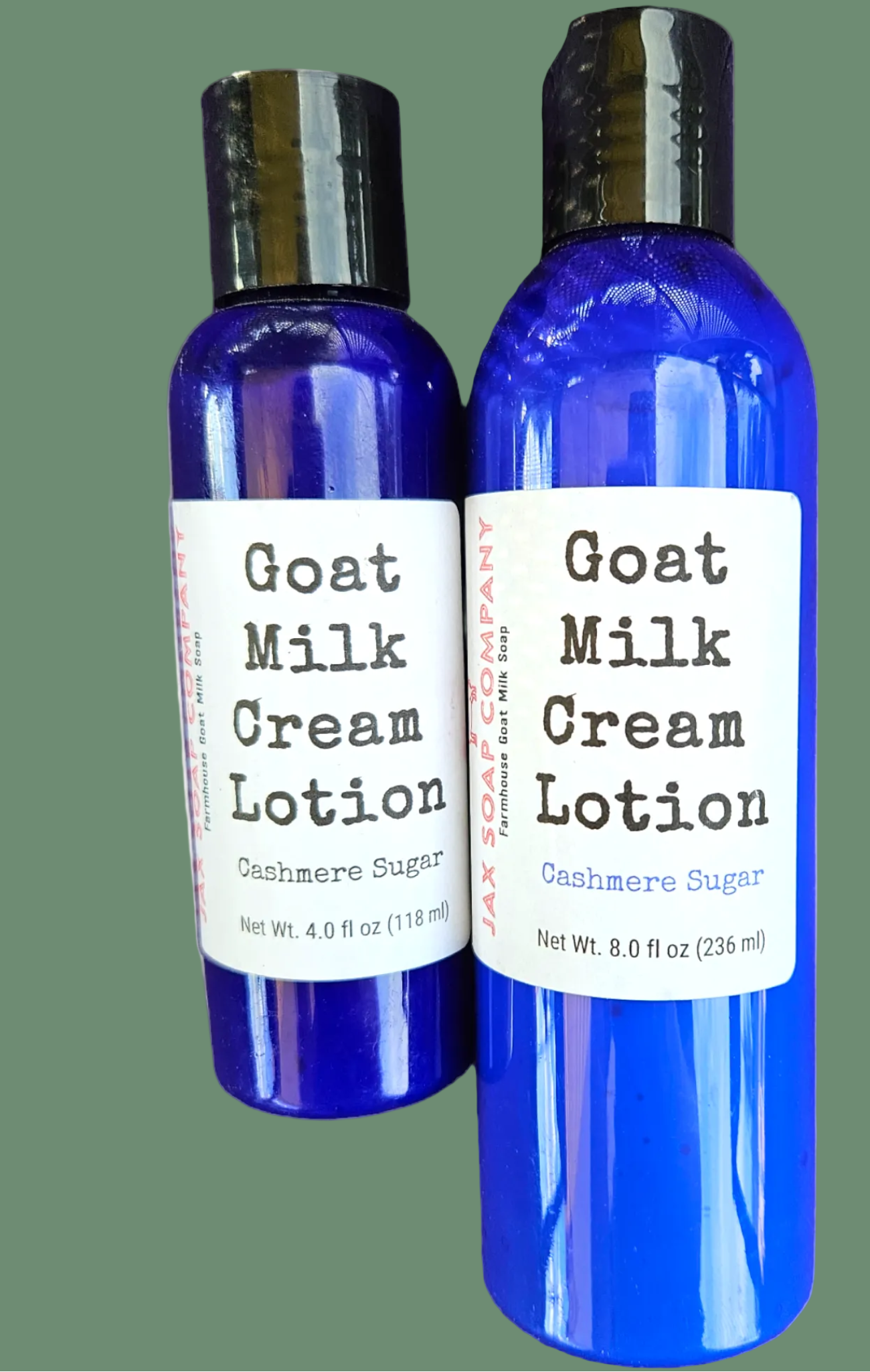 Two bottles of Goat Milk Cream Lotion on a white background