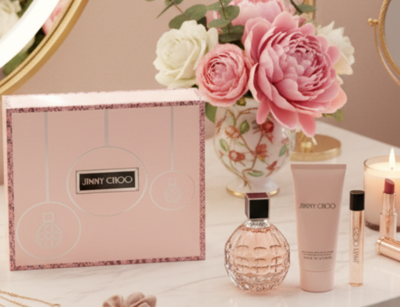 Jimmy Choo perfume set with pink packaging on a white background