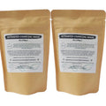 Two packages of activated charcoal mask on a white background