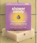 Shower candy olive oil bar soap with purple packaging on a white background
