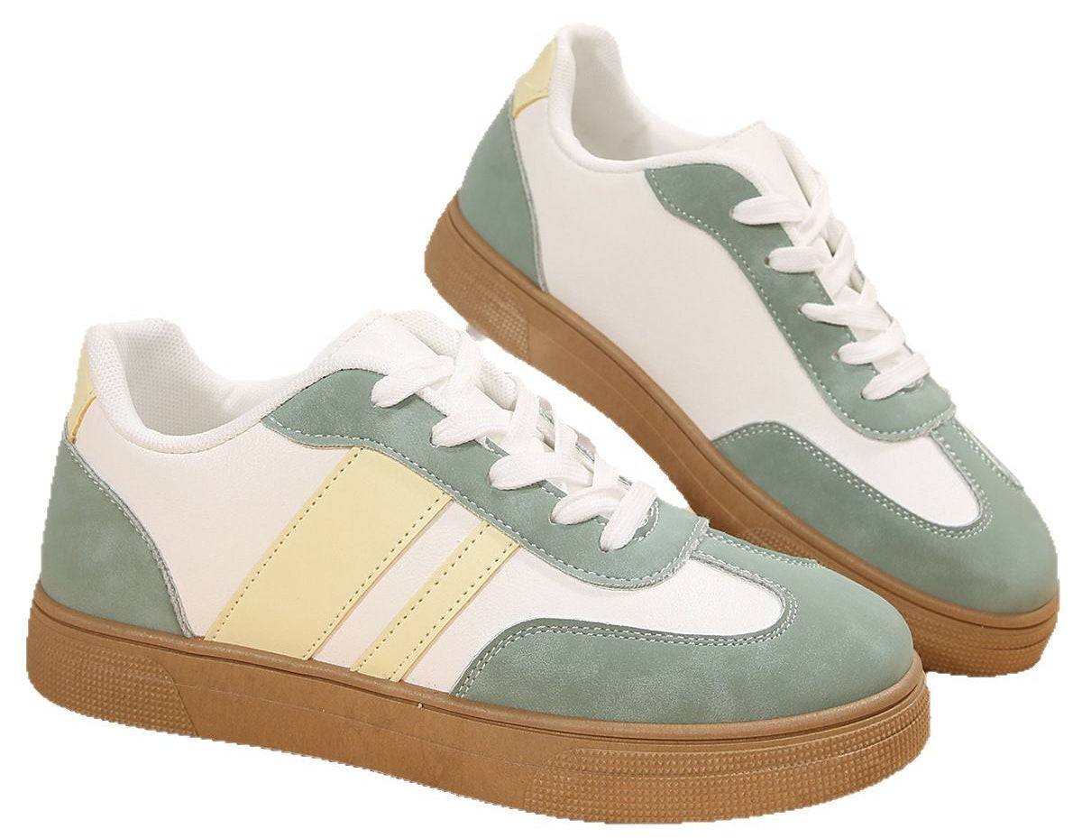 Pair of sneakers with green, white, and brown color scheme on a white background