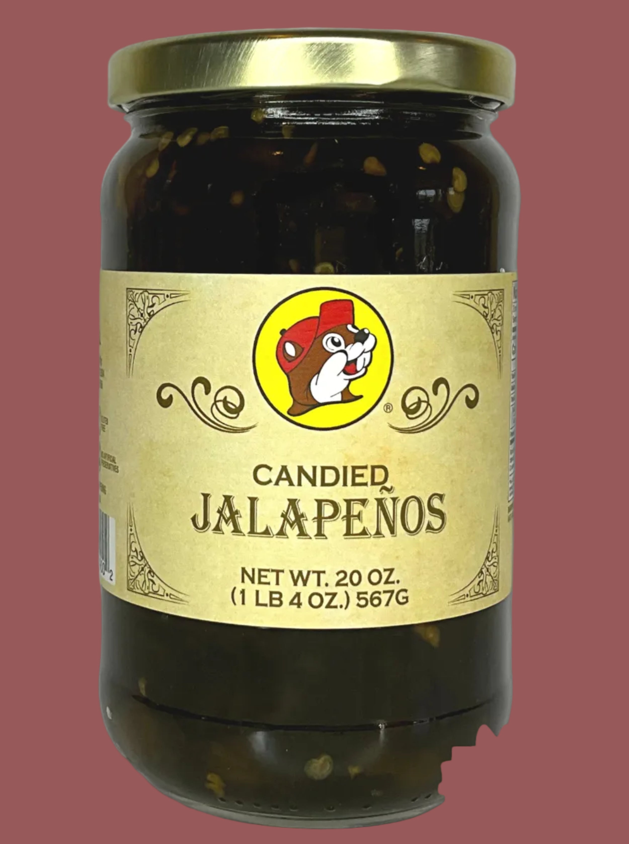 Jar of candied jalapeños with a gold label on a white background