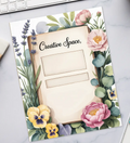 Floral-themed planner sheet on a desk with a keyboard, coffee, and stationery.