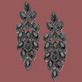 Black chandelier earrings on a white background