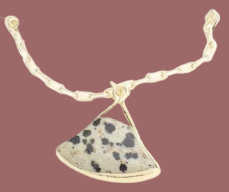 Necklace with a semi-precious stone pendant on a white background