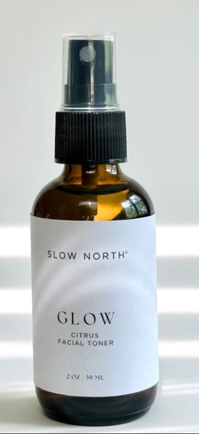 Bottle of Slow North Glow facial toner on a white background