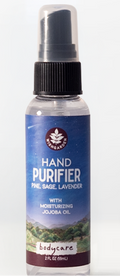 Hand purifier spray bottle with a blue label on a white background