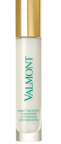 Valmont skincare serum bottle with gold cap on a white background