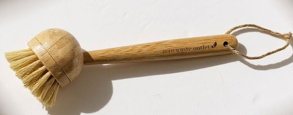 Wooden cleaning brush with bristle head on a light background